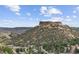 Scenic view of the apartment complex nestled near rolling hills and city, a perfect blend of nature and urban living at 20 Wilcox St # 318, Castle Rock, CO 80104