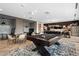Spacious common area features a pool table, kitchen, and various seating areas for residents at 20 Wilcox St # 318, Castle Rock, CO 80104