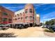 Outdoor cafe with umbrella-covered tables, perfect for al fresco dining in a vibrant urban setting at 20 Wilcox St # 318, Castle Rock, CO 80104