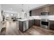 The modern kitchen features stainless steel appliances and a kitchen island at 20 Wilcox St # 318, Castle Rock, CO 80104