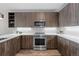 Modern kitchen with stainless steel appliances, light countertops, and stylish cabinetry at 20 Wilcox St # 318, Castle Rock, CO 80104