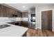 Modern kitchen with stainless steel appliances, wood cabinets, and white countertops at 20 Wilcox St # 318, Castle Rock, CO 80104
