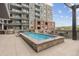 The rooftop lounge features a tranquil pool and lounge chairs for residents at 20 Wilcox St # 318, Castle Rock, CO 80104