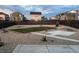 Spacious backyard with a combination of grass, gravel, and concrete patio at 126 S Vandriver Way, Aurora, CO 80018