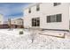 Back exterior featuring drought landscaping covered with snow at 126 S Vandriver Way, Aurora, CO 80018