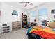 Sunlit bedroom with a fun, -friendly design, featuring themed decorations and a comfortable bed at 126 S Vandriver Way, Aurora, CO 80018