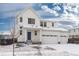 Charming two-story home with three-car garage and classic design, complemented by landscaped front yard at 126 S Vandriver Way, Aurora, CO 80018