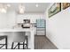 Bright kitchen featuring an island with bar seating, modern appliances, and white cabinetry at 126 S Vandriver Way, Aurora, CO 80018