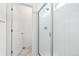 Modern walk-in shower with white tile and glass door in a bright bathroom at 126 S Vandriver Way, Aurora, CO 80018