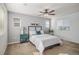 Airy bedroom with natural light, neutral tones, ceiling fan and plush carpet at 3389 Cranston Cir, Highlands Ranch, CO 80126