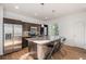 Modern kitchen features stainless appliances, granite counters, and an island with bar seating at 3389 Cranston Cir, Highlands Ranch, CO 80126