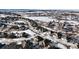 Panoramic aerial view of the neighborhood in winter, showcasing the community layout and surrounding landscape at 4122 Spanish Oaks Trl, Castle Rock, CO 80108