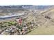 An aerial view of the property and surrounding neighborhood in a valley with mountains in the background at 3995 Easley Rd, Golden, CO 80403