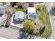 Overhead view of a home with a two-car garage, solar panels, and well-maintained lawn at 3995 Easley Rd, Golden, CO 80403