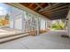 Exterior view of carport and garage featuring blue wood siding and a driveway at 3995 Easley Rd, Golden, CO 80403