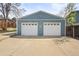 Spacious two-car garage with white doors and ample driveway space at 3995 Easley Rd, Golden, CO 80403