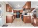 Functional kitchen with wood cabinets, ample counter space, and convenient access to the dining area at 3995 Easley Rd, Golden, CO 80403