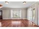 Bright living room with hardwood floors, large windows, and a sliding glass door at 3995 Easley Rd, Golden, CO 80403