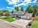 Beautiful two-story home featuring a well-manicured lawn and an ample driveway at 6716 W Rowland Ave, Littleton, CO 80128