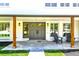 Inviting front porch featuring a seating area and stylish gray double-door entrance at 6716 W Rowland Ave, Littleton, CO 80128