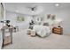 Bright main bedroom with a neutral color palette, carpet flooring, shutters and a ceiling fan at 6716 W Rowland Ave, Littleton, CO 80128