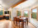 Dining room with hardwood floors and lots of natural light and views of mountains at 28465 Cragmont Dr, Evergreen, CO 80439