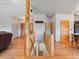 View of the foyer with wood floors, wood railings and banister, and various doors at 28465 Cragmont Dr, Evergreen, CO 80439