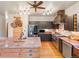 Bright, spacious kitchen features an island, a view of stainless steel appliances, and custom hood at 28465 Cragmont Dr, Evergreen, CO 80439