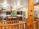 Open kitchen with custom range hood, wooden beams, with the dining area in the background at 28465 Cragmont Dr, Evergreen, CO 80439