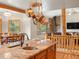 Open-concept kitchen with granite countertops, copper sink, and seamless flow to dining and living areas at 28465 Cragmont Dr, Evergreen, CO 80439