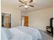 Bright bedroom featuring a wood-burning stove and multiple windows at 28465 Cragmont Dr, Evergreen, CO 80439