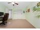 Bright bedroom featuring neutral carpet, ample closet space, and a ceiling fan for optimal comfort at 980 S Nile Way, Aurora, CO 80012