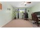 Well-lit bedroom showcasing large windows, neutral carpet, and comfortable furnishings for a relaxing atmosphere at 980 S Nile Way, Aurora, CO 80012