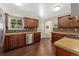 Spacious kitchen with stainless steel dishwasher and ample wooden cabinet space at 980 S Nile Way, Aurora, CO 80012