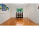 Spacious finished room with wood floors and natural light, offering flexible living space at 980 S Nile Way, Aurora, CO 80012
