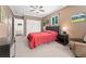 Spacious main bedroom with a large closet, ceiling fan, and comfortable seating area at 980 S Nile Way, Aurora, CO 80012