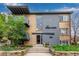 Brick apartment building featuring gray accents, balconies and professional landscaping at 200 N Sherman St # 7, Denver, CO 80203