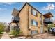 Rear brick elevation featuring balconies and residential parking at 200 N Sherman St # 7, Denver, CO 80203