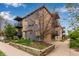 Apartment building features brick exterior, balconies and mature landscaping at 200 N Sherman St # 7, Denver, CO 80203