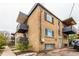 Three-story apartment building featuring small, modern balconies and brick exterior at 200 N Sherman St # 7, Denver, CO 80203