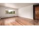Bright living space featuring hardwood floors and large window at 200 N Sherman St # 7, Denver, CO 80203