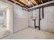 Unfinished basement area showing exposed utilities and potential for renovation and customization at 17681 E Loyola Dr # E, Aurora, CO 80013