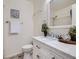 Charming bathroom featuring a vanity with a marble countertop and updated fixtures at 17681 E Loyola Dr # E, Aurora, CO 80013