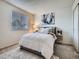 Cozy bedroom with a comfortable bed, stylish decor, and a window offering natural light at 17681 E Loyola Dr # E, Aurora, CO 80013