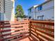 Cozy deck with wood railing offers a private outdoor retreat at 17681 E Loyola Dr # E, Aurora, CO 80013