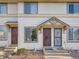 Inviting townhouse exterior with well-maintained landscaping and charming entryway at 17681 E Loyola Dr # E, Aurora, CO 80013