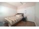 Bright bedroom featuring a striped wall design, wood flooring, and a comfortable twin bed at 5732 S Addison Way # E, Aurora, CO 80016