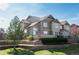 Attractive townhome with stone accents, neat landscaping, and inviting curb appeal in a desirable community at 5732 S Addison Way # E, Aurora, CO 80016