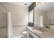 Updated bathroom features textured tile walls, modern fixtures, and a window view at 96 Glenmoor Ln, Cherry Hills Village, CO 80113