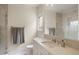 Elegant bathroom with marble countertops, a glass shower, and subtle decorative touches evokes spa-like tranquility at 96 Glenmoor Ln, Cherry Hills Village, CO 80113